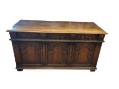 A 17th century style oak coffer, width 116cm, depth 49cm, height 61cm