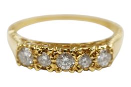 A 1980's 18ct gold and five stone diamond set half hoop ring, size O/P, gross weight 2.8 grams.