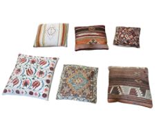 Six Kelim and embroidered cushions, largest 47 x 47cm