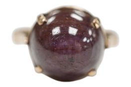 A yellow metal (stamped 14k) and cabochon star ruby set ring, size N, gross weight 5.4 grams.