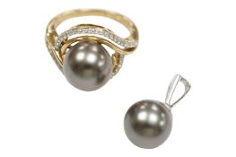 A recent 9ct gold and single stone black cultured pearl ring, with diamond set crossover