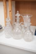 Three 19th century glass decanters and stoppers, largest 30cm, one other, a carafe and oversized