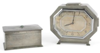 Liberty & Co: A Tudric pewter cigarette box and a BCM/Tudric pewter mantel timepiece, early 20th