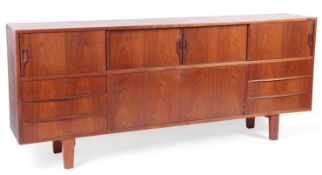A mid-century teak sideboard, 1960s, the rectangular top above an arrangement of sliding cupboard