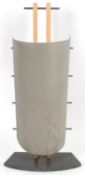 Manner of Wales & Wales of Chiddingly: A stylised stick stand, with curved sheet metal front and