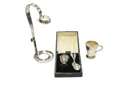A cased modern silver christening egg cup an associated silver spoon, together with two other silver