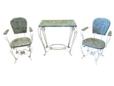 A wrought iron garden table, width 83cm, depth 57cm height 77cm and a pair of chairs
