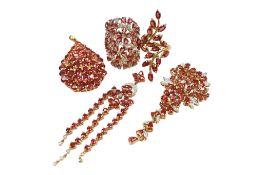 A collection of recent orange and white sapphire jewels, to include three cluster pendants, one