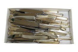 A set of twelve Elizabeth II silver handed fiddle pattern stainless steel table knives and eleven