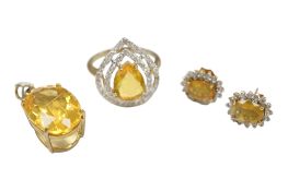 A recent 9ct gold and single stone pear cut Welo opal ring, with simulated diamond set two row