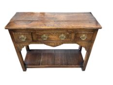 A small reproduction 18th century style oak low pot board dresser, fitted three drawers, width 91cm,