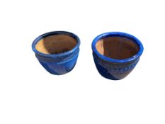 A pair of blue glazed ceramic planters, diameter 52cm, height 32cm