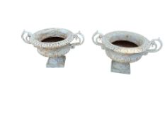 A pair of Victorian style white painted cast iron campana urns, diameter 40cm, height 36cm