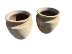 A pair of terracotta planters, diameter 50cm, height 56cm