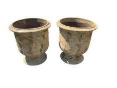 A pair of large circular terracotta urns, diameter 60cm, height 64cm