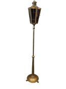 An early 20th century brass hexagonal lantern top standard lamp inset ruby glass panels, height
