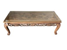 A Chinese carved hardwood low table, width 122cm, depth 49cm, height 41cm