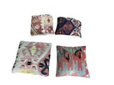 Four Kilim polychrome cushions, largest 42 x 43cm