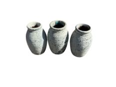 Three small blue garden urns, height 25cm
