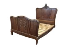 An early 20th century French Louis XV style oak double bedframe, length 215cm, width 145cm, height 1