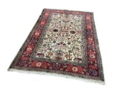 An Indian ivory ground carpet, 336 x 225cm