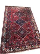 A Hamadan blue ground rug, 245 x 158cm, a North West Persian rug, 145 x 105cm and one other, 100 x 6