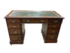 An Edwardian walnut twin pedestal desk, width 118cm, depth 57cm, height 70cm
