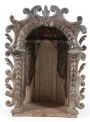 A Spanish Baroque silvered wood altar niche, 17th century,the arcaded recess carved with foliage and
