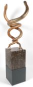 After Edgar Brandt (French, 1880-1960): A gilded iron group of two entwined serpents,