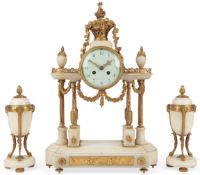 A Louis XVI style white marble and ormolu mounted three piece clock garniture including a pair of