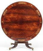 A Regency brass inlaid rosewood breakfast table, in the manner of George Oakley, the circular tilt