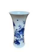 A Chinese blue and white waisted vase, painted with figures in a landscape, 39cm high