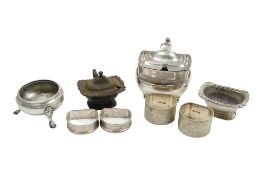 A George III silver mustard pot, London 1807, together with four silver serviette rings and three