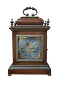 An 18th century-style bracket clock with silvered dial, striking on a coiled gong, with pendulum, no