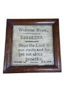 A 19th century framed sampler ‘Welcome Home Ebenezer’ dated 1846, width 25cm.
