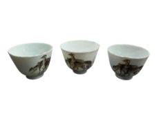 Three Chinese porcelain teabowls decorated with hunting hounds, 7cm
