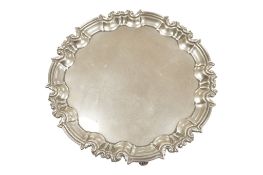 An Edwardian silver salver, by William Hutton & Sons, London, 1906, on three scroll feet, diameter