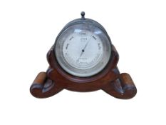 A Victorian J.B. Dancer barometer with silvered dial, mahogany stand, height 18cm.