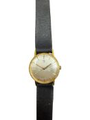 A gentleman's early 1960's 18ct gold Omega manual wind wrist watch, with baton numerals, case
