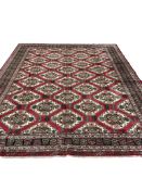 A Turkman red ground carpet, 386 x 300cm