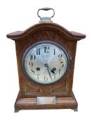An early 20th century brass mounted oak bracket clock, silvered dial marked Kibble, London, height