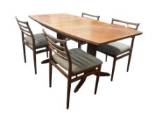 A mid century G Plan teak dining suite, comprising table, four chairs and a sideboard, table