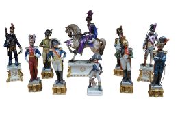 A collection of ten Capodimonte soldier figurines to include a equestrian figure group, tallest 37cm