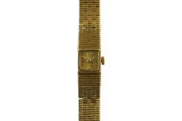 A lady's 18k manual wind bracelet wrist watch, the square dial with baton numerals, overall length
