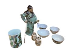 A collection of Chinese pottery and porcelain to include a figure of a warrior and a famille verte