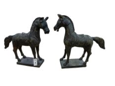 A pair of archaistic Tibetan-style hollowcast copper horses, 54cm high