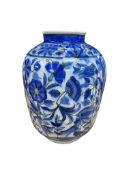 An Persian Iznik-style blue and white vase, height 25cm.