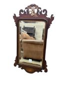A George III style shell inlaid mahogany fret cut wall mirror, width 51cm, height 92cm