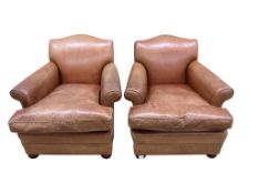 A pair of tan leather club chairs, width 87cm, depth 72cm, height 78cm
