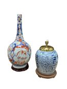 A Japanese Imari bottle vase raised on associated hardwood stand, along with a Chinese blue and
